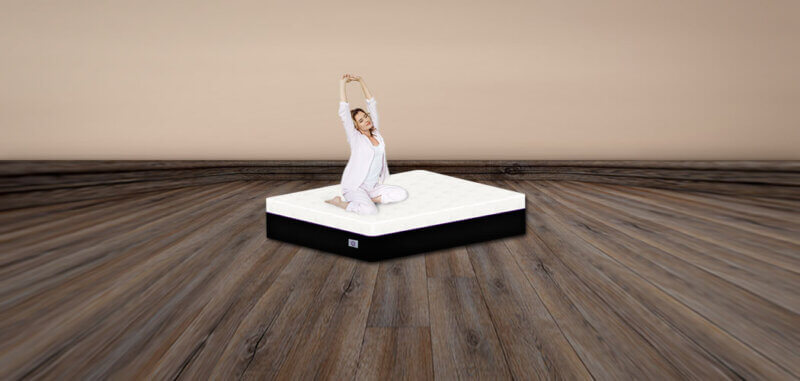Woman Sitting on the Omni Mattress