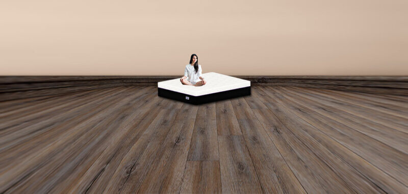 Black hair lady sitting on a Omni Mattress